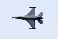Fighter jet in the sky representing the aerospace and defense industry.