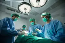 Surgeons in an operating room representing the medical industry.