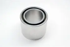 A precision machined cylindrical metal part for scientific instruments.