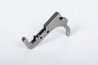 Trigger made via fineblanking, DDG, and CNC milling