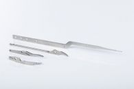 Multiple fineblanked, machined and ground medical components
