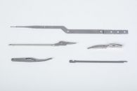 Multiple development parts made via fineblanking, grinding and milling